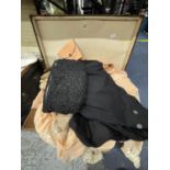 A VINTAGE SUITCASE CONTAINING A LARGE QUANTITY OF VINTAGE CLOTHING AND LINGERIE