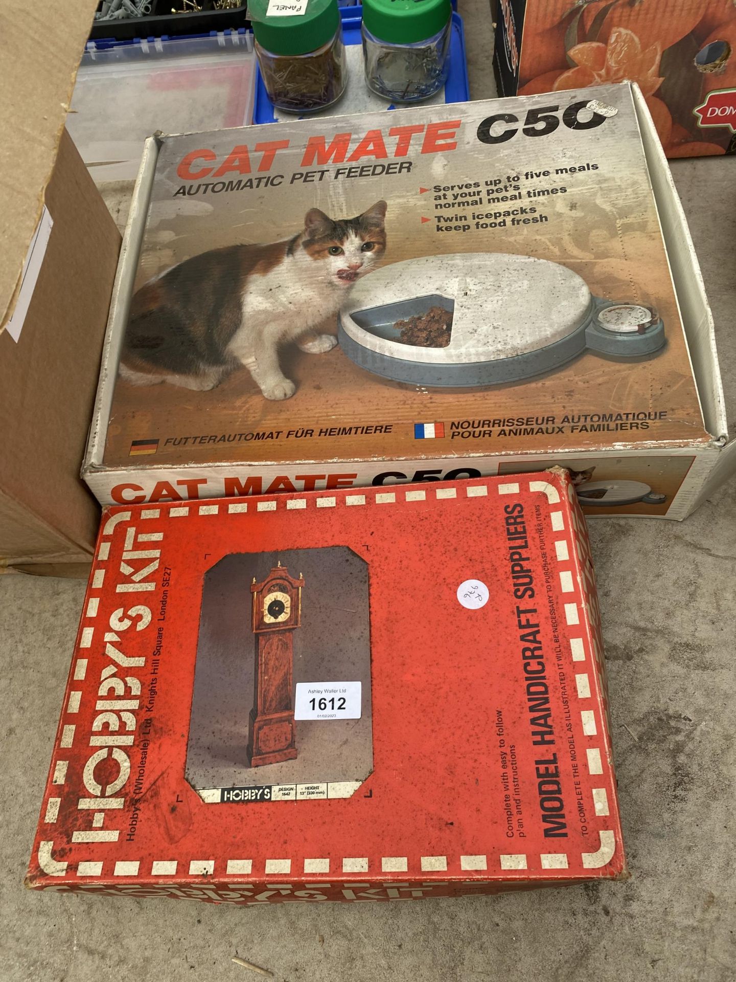A HOBBY'S KIT AND A CAT MATE PET FEEDER