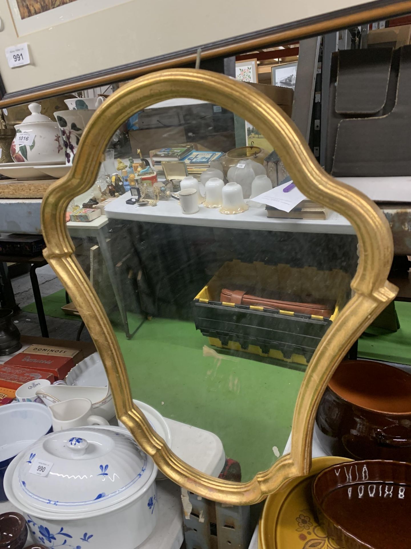 A VINTAGE STYLE SHIELD SHAPED MIRROR WITH GILT FRAME