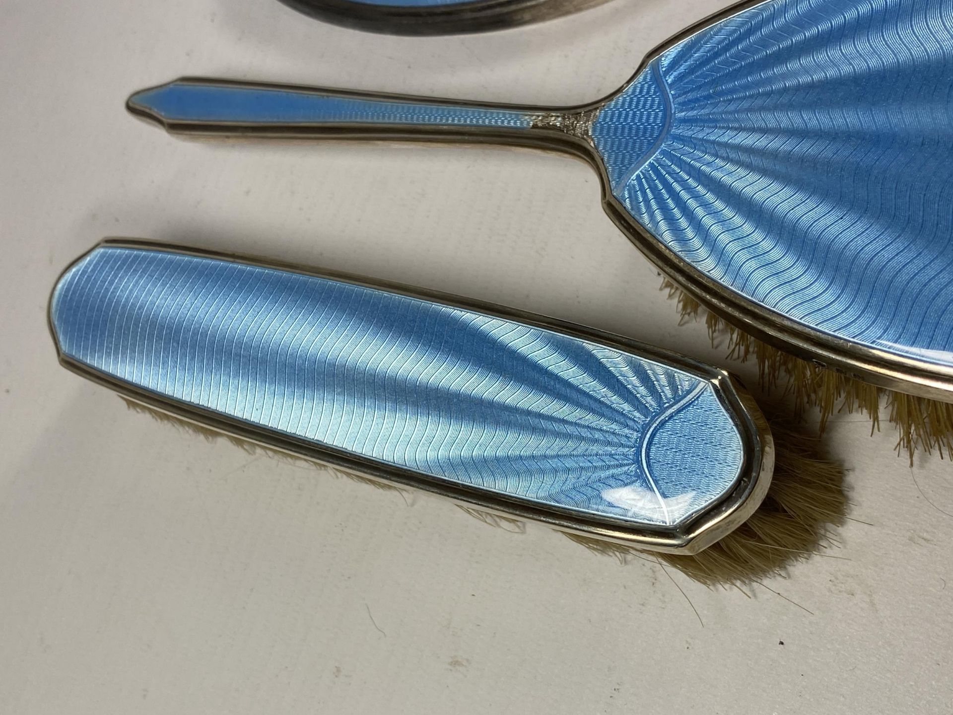 A FIVE PIECE HALLMARKED SILVER BACKED & BLUE GUILLOCHE ENAMEL DRESSING SET COMPRISING TWO HAIR - Image 4 of 9