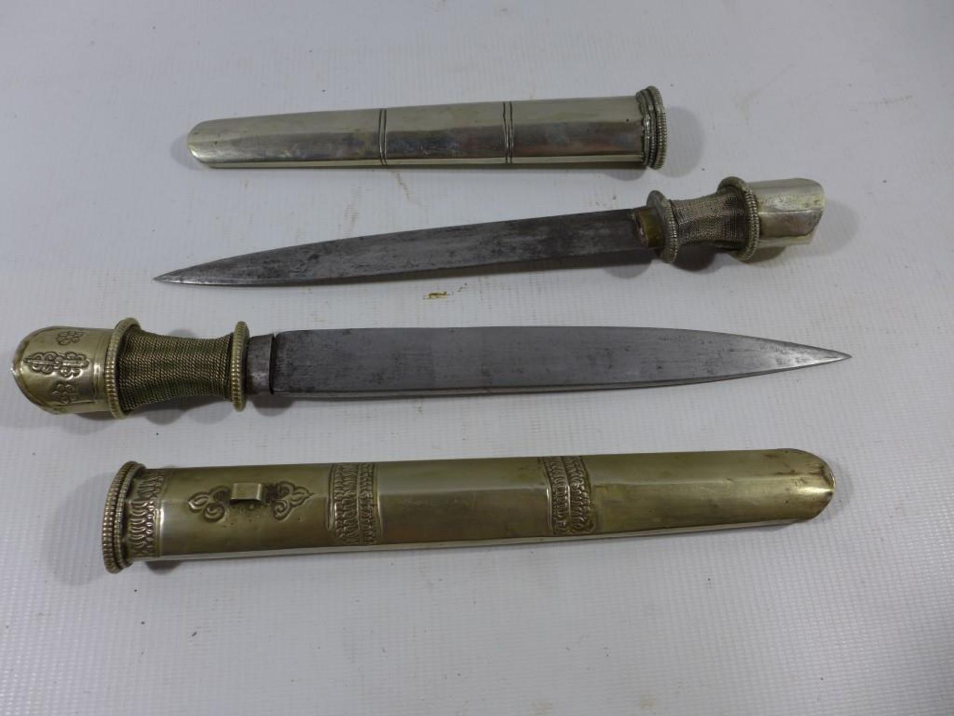 TWO FAR EASTERN DAGGERS AND SCABBARDS, 20CM AND 23CM BLADES