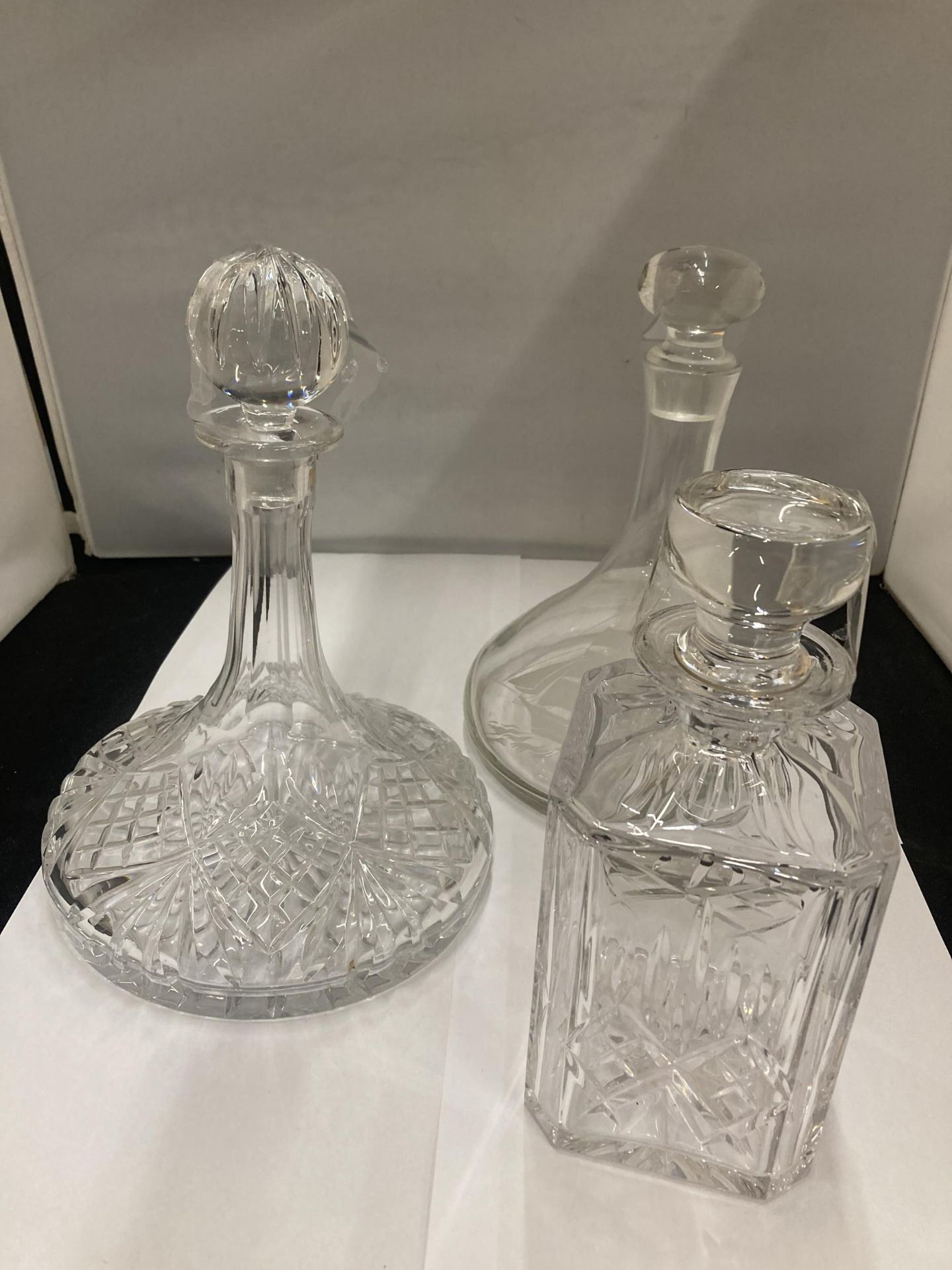 THREE GLASS DECANTERS TO INCLUDE TWO SHIPS DECANTERS