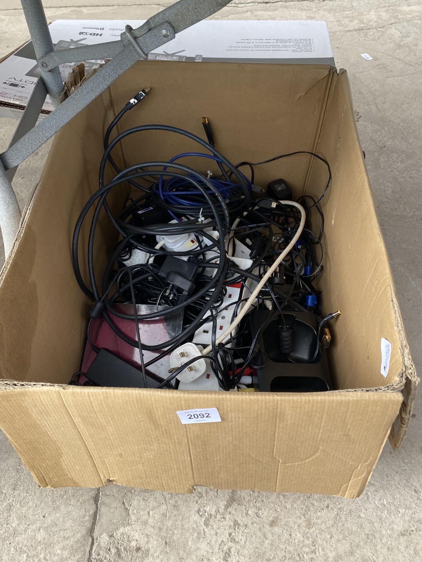 A LARGE ASSORTMENT OF CABLES AND CHARGERS
