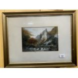 A FRAMED WATERCOLOUR OF A MOUNTAIN AND LAKE SCENE, SIGNED TO BOTTOM RIGHT 54CM X 41CM