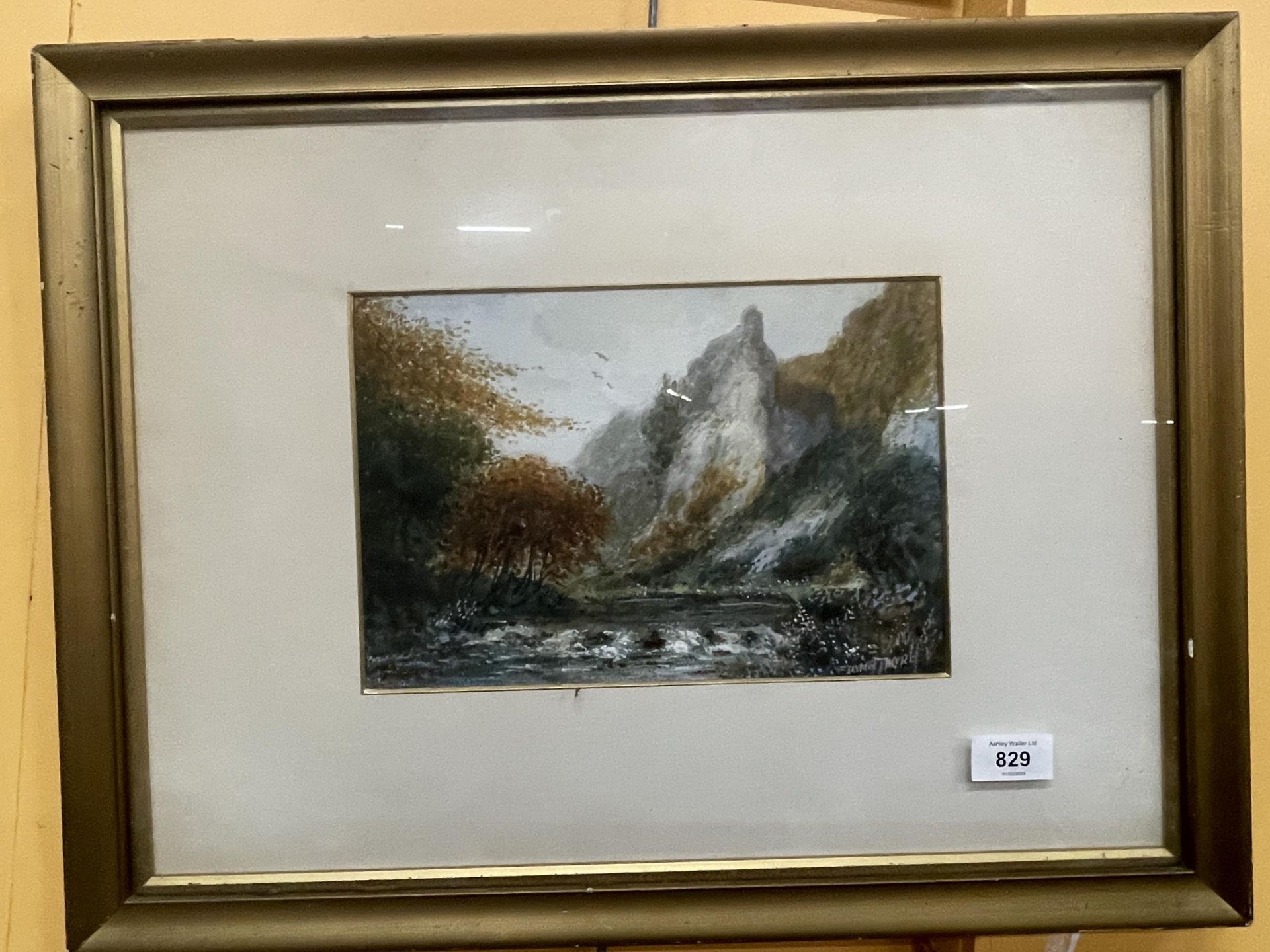 A FRAMED WATERCOLOUR OF A MOUNTAIN AND LAKE SCENE, SIGNED TO BOTTOM RIGHT 54CM X 41CM