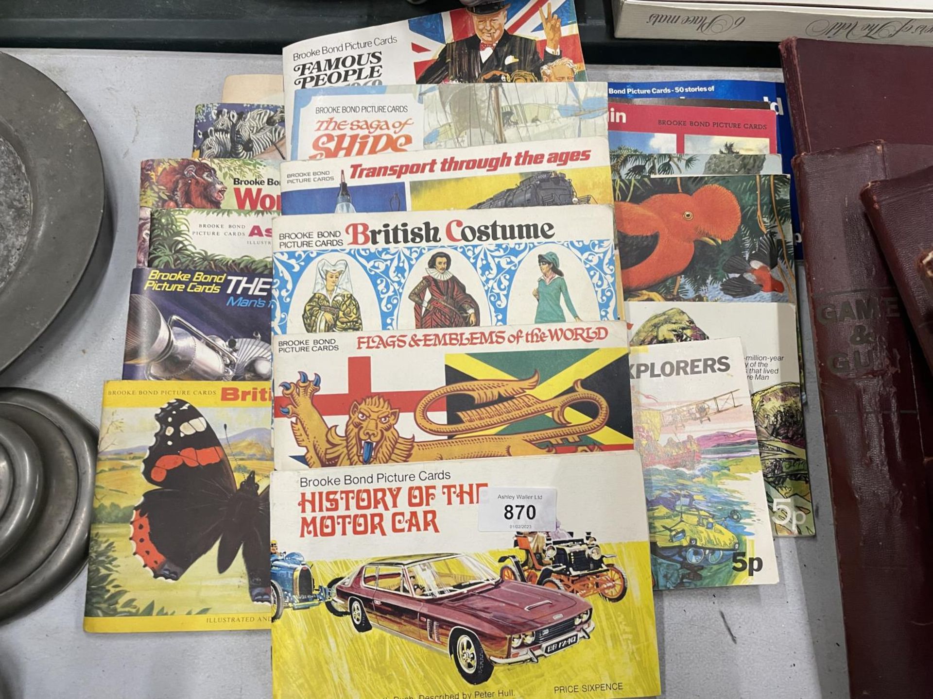 A LARGE QUANTITY OF BROOKE BOND PICTURE TEA CARDS IN ALBUMS TO INCLUDE THE MOTOR CAR, FLAGS,