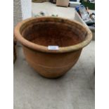 A LARGE TERRACOTTA PLANT POT