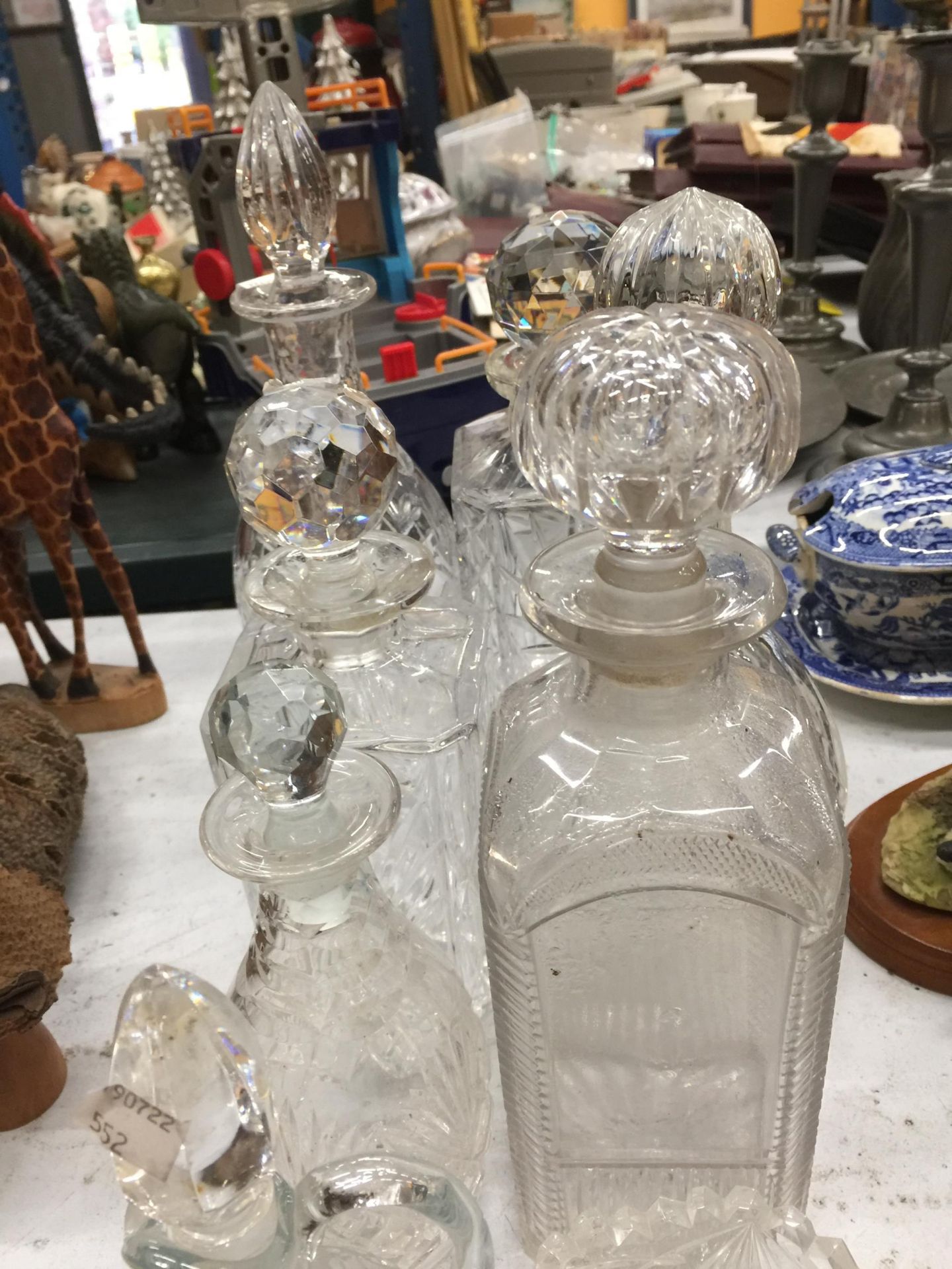 A QUANTITY OF GLASSWARE DECANTERS PLUS AN OIL BOTTLE AND TEALIGHT HOLDERS - Image 2 of 3