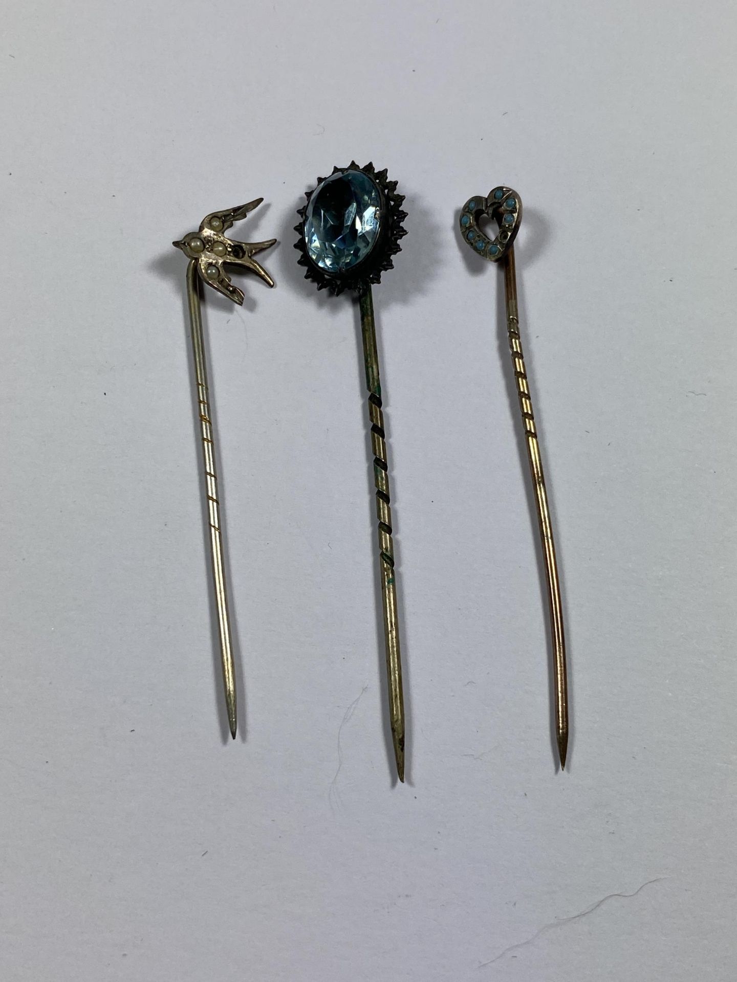 THREE VINTAGE STICK PINS TO INCLUDE BIRD DESIGN EXAMPLE