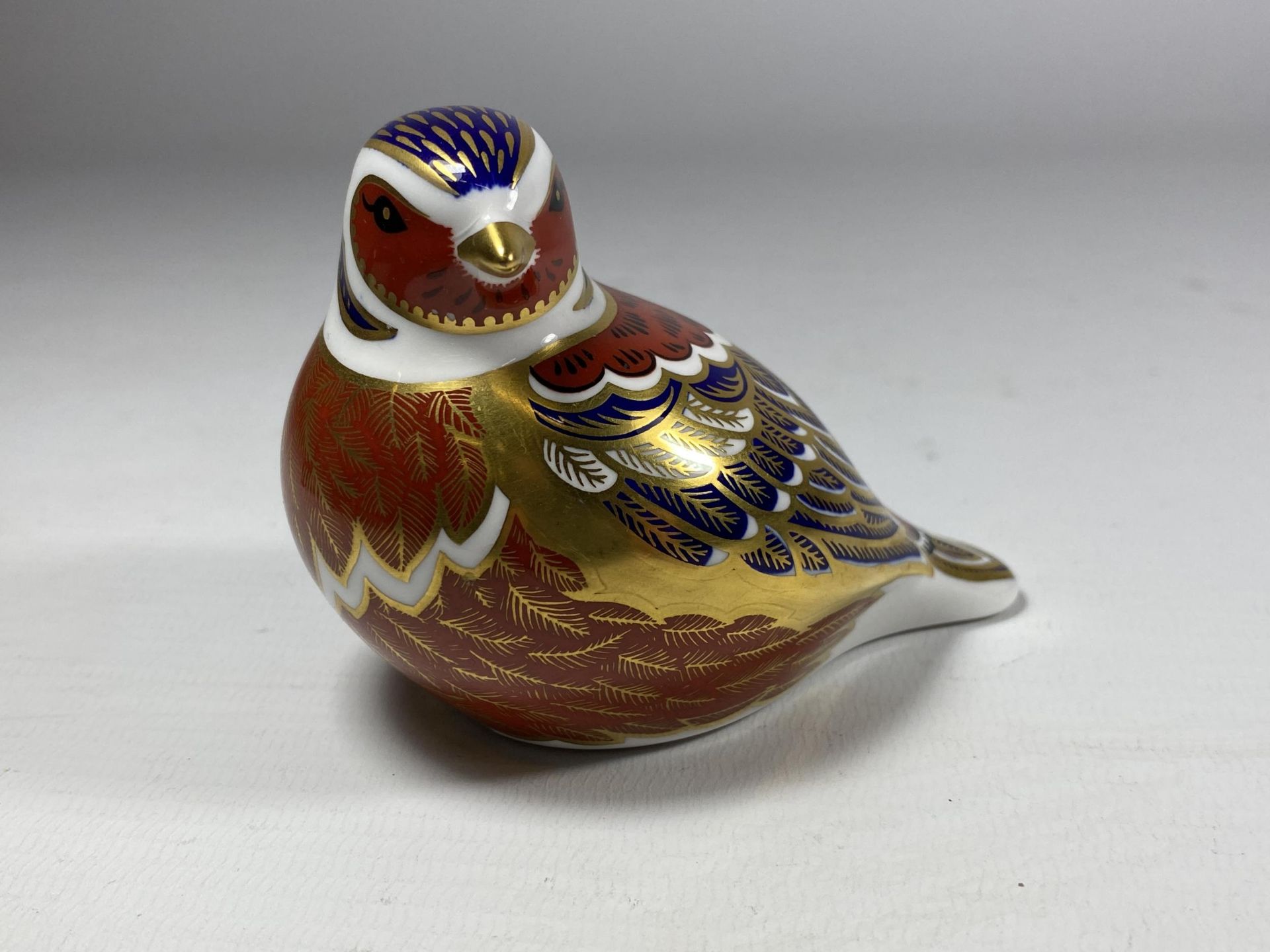 A ROYAL CROWN DERBY IMARI CHAFFINCH PAPERWEIGHT WITH GOLD STOPPER