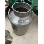 A STAINLESS STEEL NESTLE MILK CHURN