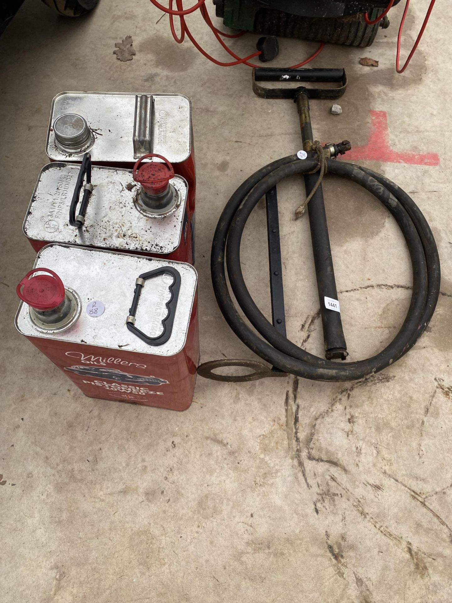 A VINTAGE STIRRUP PUMP AND THERE OIL CANS
