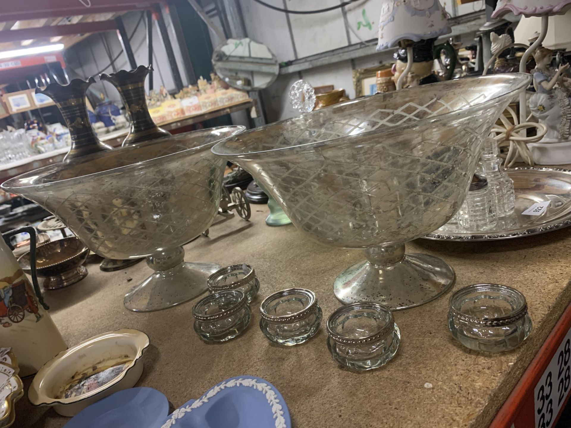 TWO LARGE GLASS FOOTED BOWLS WITH SILVER COLOURED BASE AND FIVE GLASS TEALIGHT HOLDERS