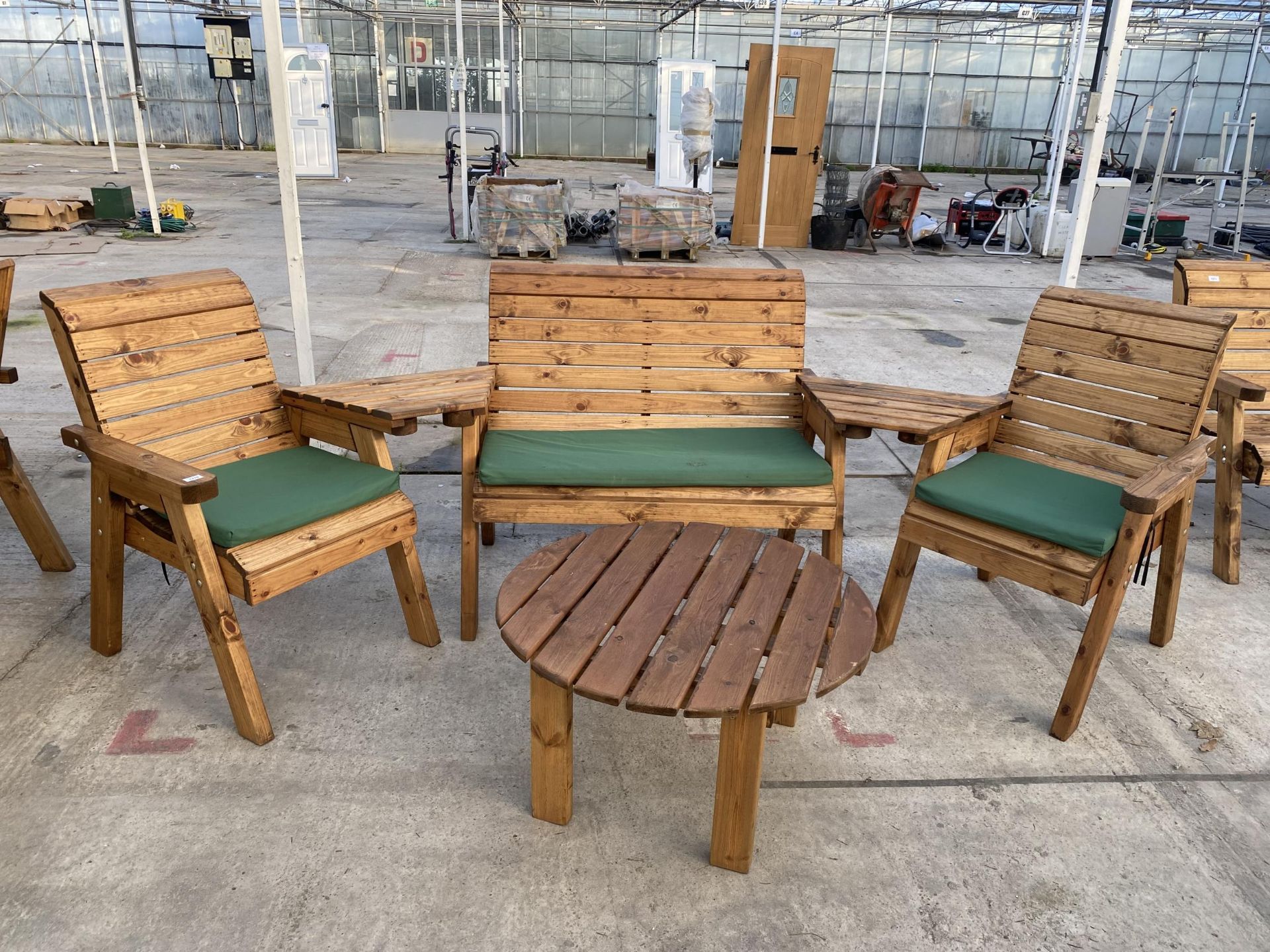 AN AS NEW EX DISPLAY CHARLES TAYLOR PATIO SET COMPRISING OF A BENCH, TWO CHAIRS, A ROUND COFFEE