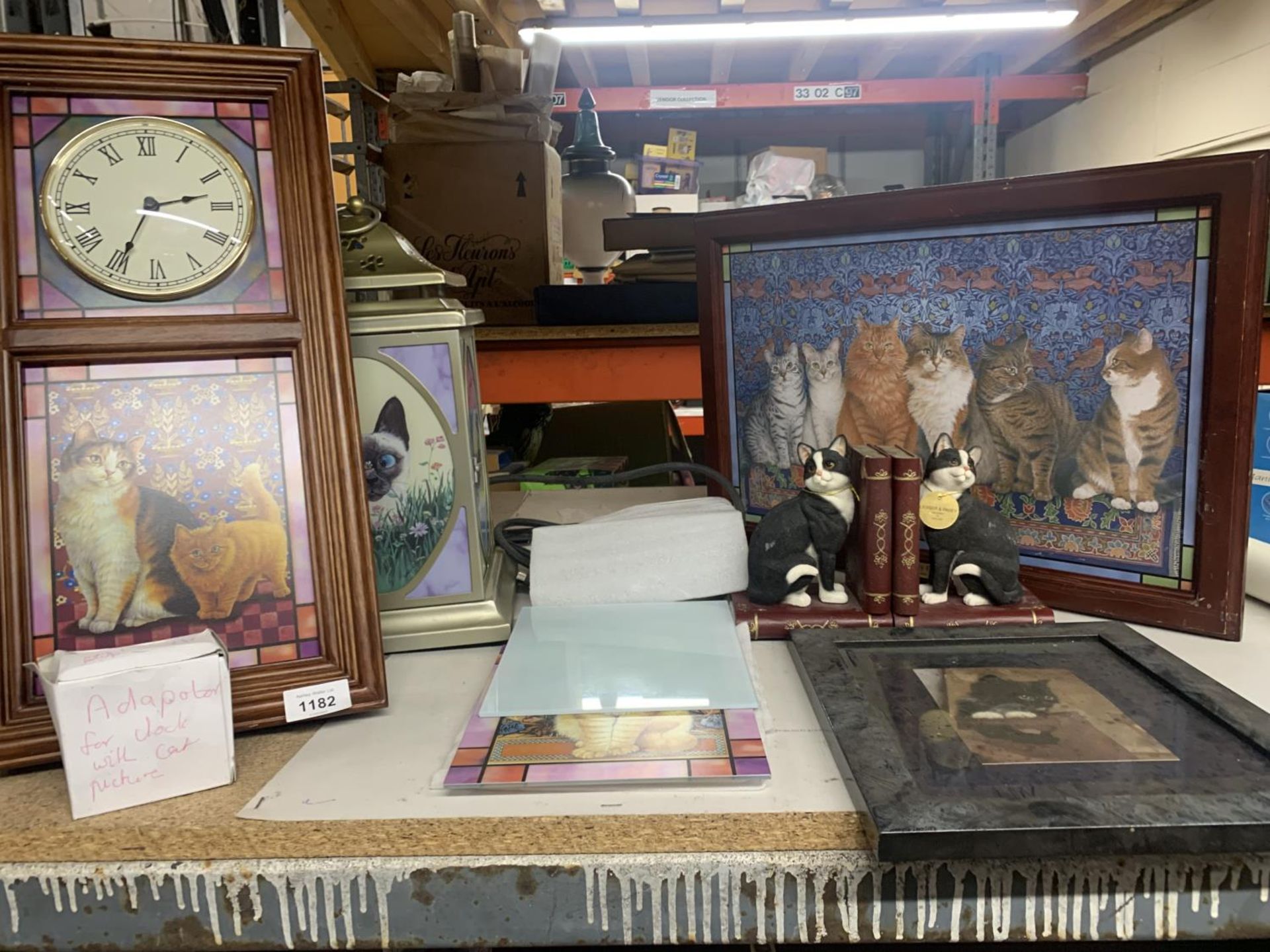 A QUANTITY OF CAT RELATED ITEMS TO INCLUDE A CLOCK, LANTERN, BOOKENDS, STAINED GLASS PANORAMA, ETC