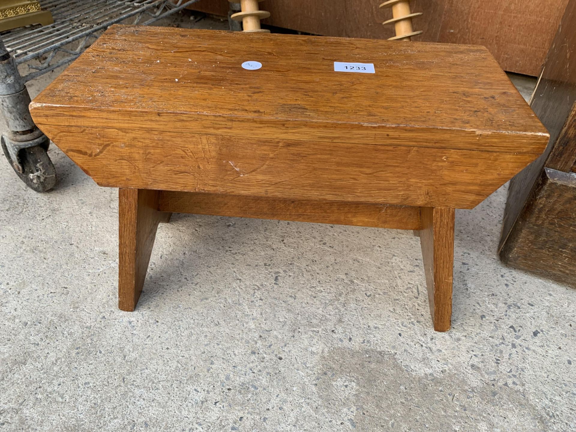 A SMALL WOODEN OAK STOOL