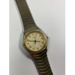 A LADIES 'EBEL' STAINLESS STEEL DATE WATCH