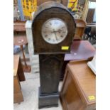 AN OAK GRANDMOTHER CLOCK WITH QUARTZ MOVEMENT