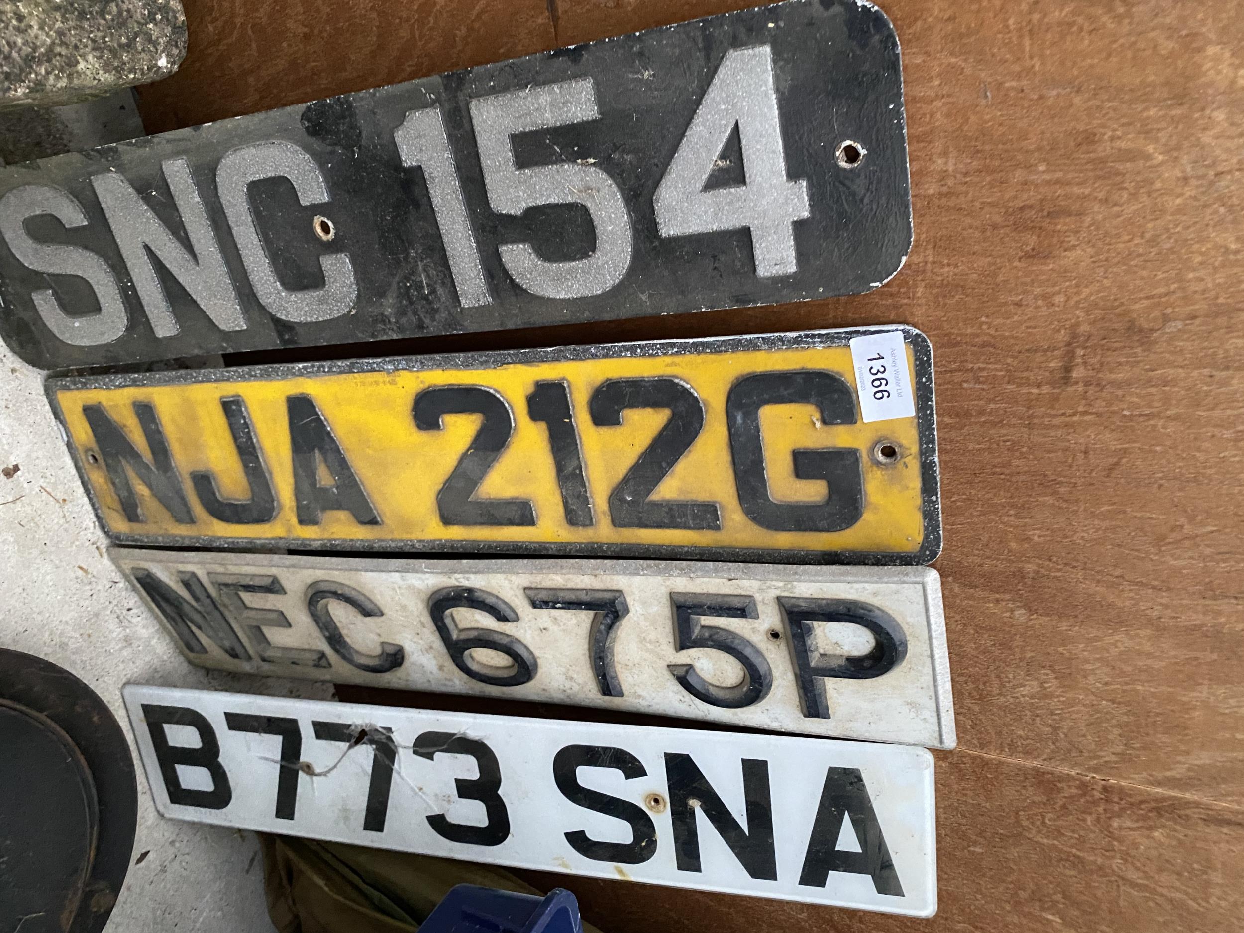 AN ASSORTMENT OF VINTAGE NUMBER PLATES