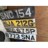 AN ASSORTMENT OF VINTAGE NUMBER PLATES