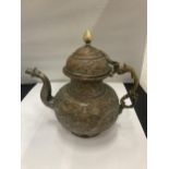 AN ASIAN STYLE COPPER TEAPOT WITH EMBOSSED DESIGN
