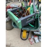 AN ASSORTMENT OF GARDEN TOOLS TO INCLUDE A WHEEL BARROW, A HOSE REEL AND A BATTERY HEDGE TRIMMER ETC