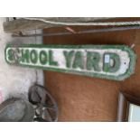 A VINTAGE PAINTED HEAVY CAST IRON 'SCHOOL YARD' SIGN