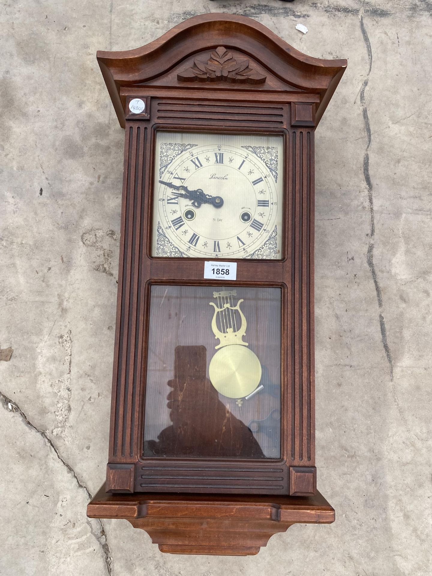 A LINCOLN 31 DAY MECHANICAL WALL CLOCK