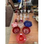 AN ASSORTMENT OF GLASS WARE TO INCLUDE CANDLESTICKS AND BOWLS ETC