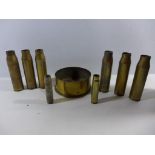 A COLLECTION OF NINE ASSORTED SHELL CASES, HEIGHTS RANGE FROM 7 TO 17CM