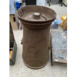 A VINTAGE CAST IRON MILK CHURN WITH HINGED LID