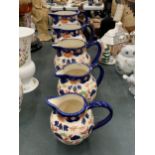 A GRADUATED SET OF FIVE 'VICTORIA' IRONSTONE JUGS