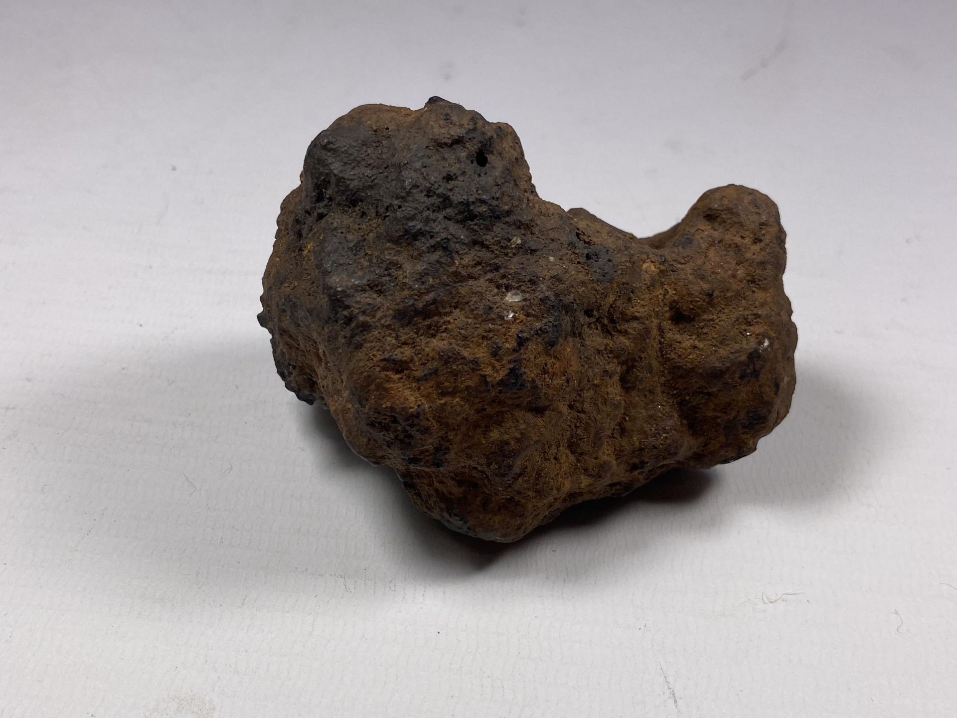 A BELIEVED METEORITE STONE, LENGTH 8CM