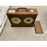 A VINTAGE WOODEN CASED MANTLE CLOCK AND BEROMETER