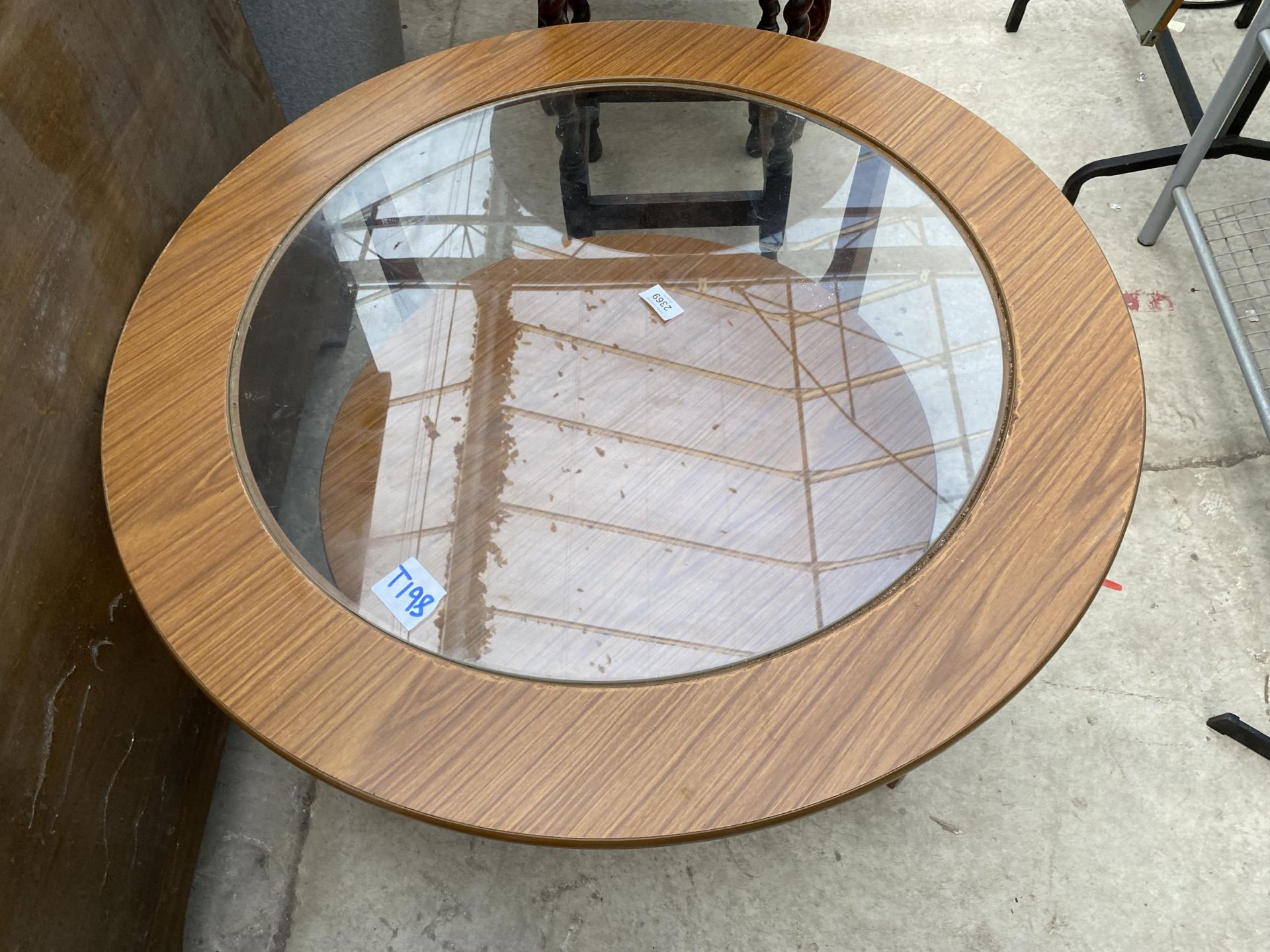 A RETRO TEAK 33" DIAMETER TWO TIER COFFEE TABLE WITH INSET GLASS TOP - Image 2 of 2