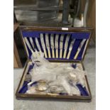 A VINTAGE MAHOGANY CASED PART CANTEEN OF CUTLERY PLUS A QUANTITY OF LOOSE FLATWARE