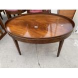 AN OVAL MAHOGANY AND INLAID COFFEE TABLE WITH GALLERY TOP, ON TAPERED LEGS, 36X24"