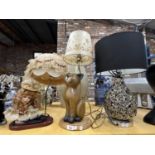 THREE TABLE LAMPS WITH SHADES, A GIRLS HEAD, A CAT AND A SILVER COLOURED BASE