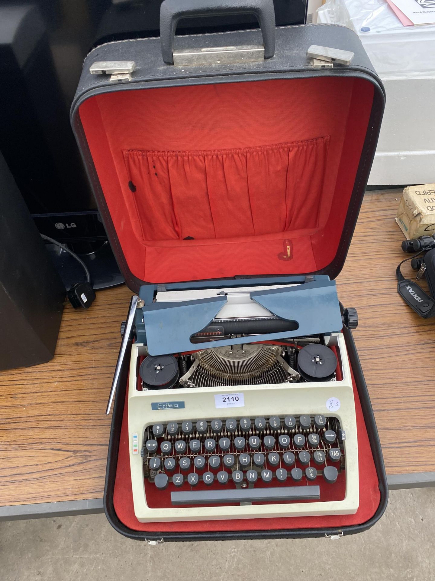 A RETRO ERIKA TYPEWRITER WITH CARRY CASE