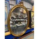 AN OVAL GILT FRAMED 'LAUNDRY ROOM' DROP YOUR DRAWERS HERE MIRROR, HEIGHT 60CM