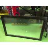 A VINTAGE WOODEN FRAMED WALL MIRROR 83CM X 52.5CM