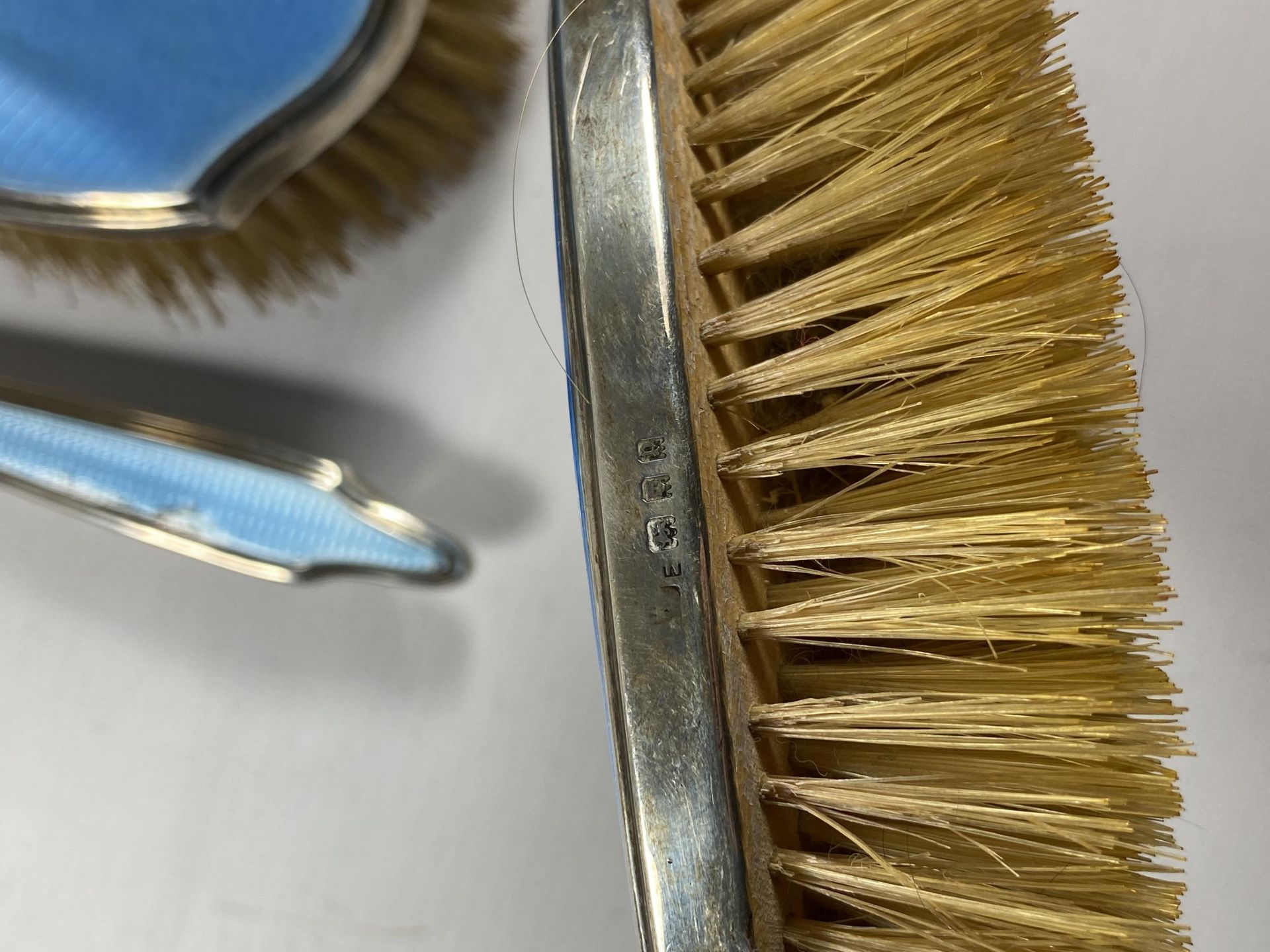 A FIVE PIECE HALLMARKED SILVER BACKED & BLUE GUILLOCHE ENAMEL DRESSING SET COMPRISING TWO HAIR - Image 6 of 9