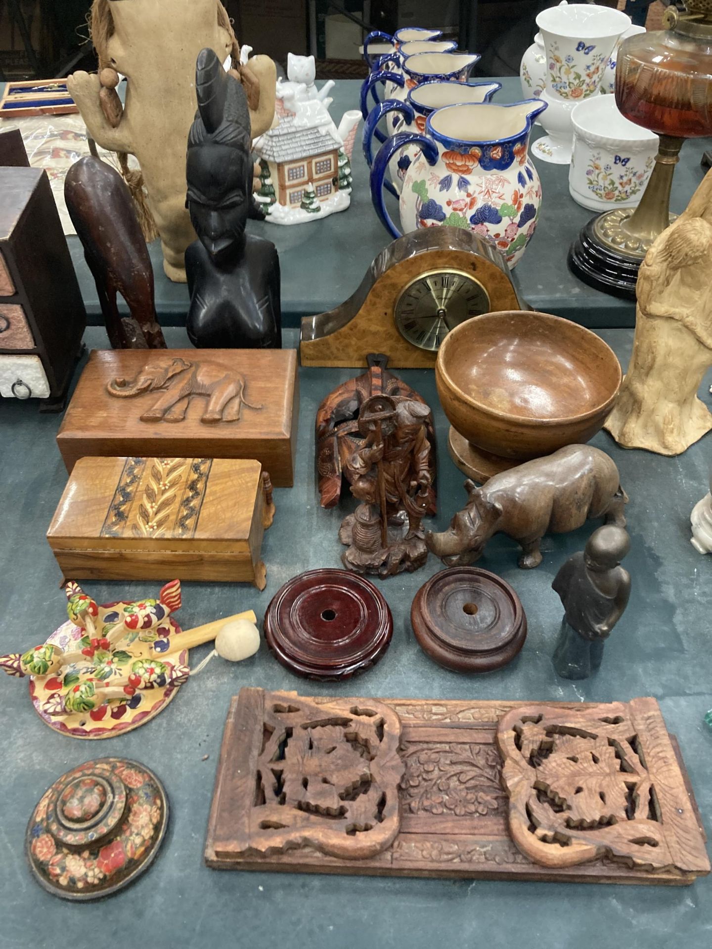 A LARGE QUANTITY OF TREEN ITEMS TO INCLUDE A SLIDING BOOKSHELF, BOXES, FIGURES, A BUST MANTLE CLOCK,