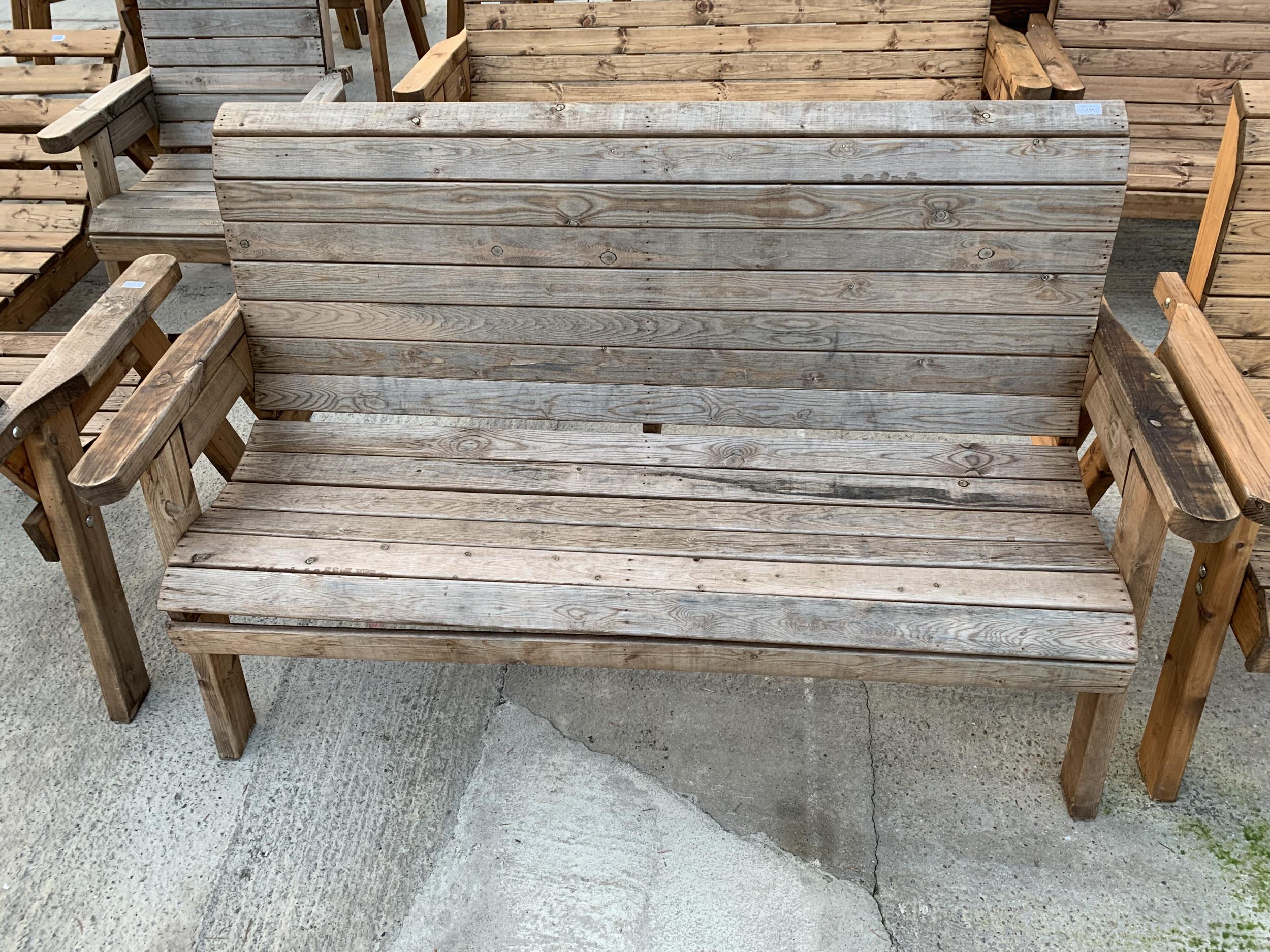 AN EX DISPLAY CHARLES TAYLOR THREE SEATER GARDEN BENCH *PLEASE NOTE VAT TO BE CHARGED ON THIS ITEM*