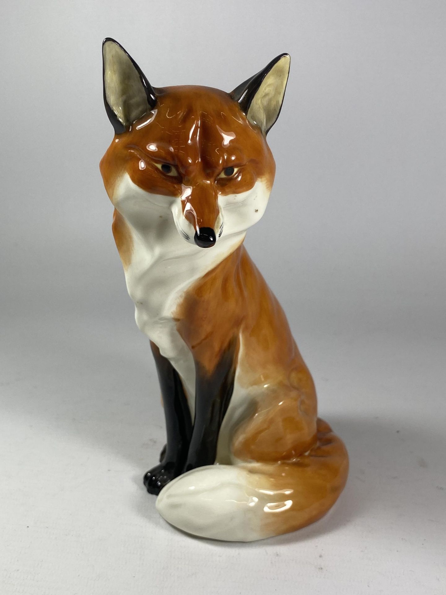 A ROYAL WORCESTER MODEL OF A SLY FOX, MODEL NO. 2993, HEIGHT 19CM