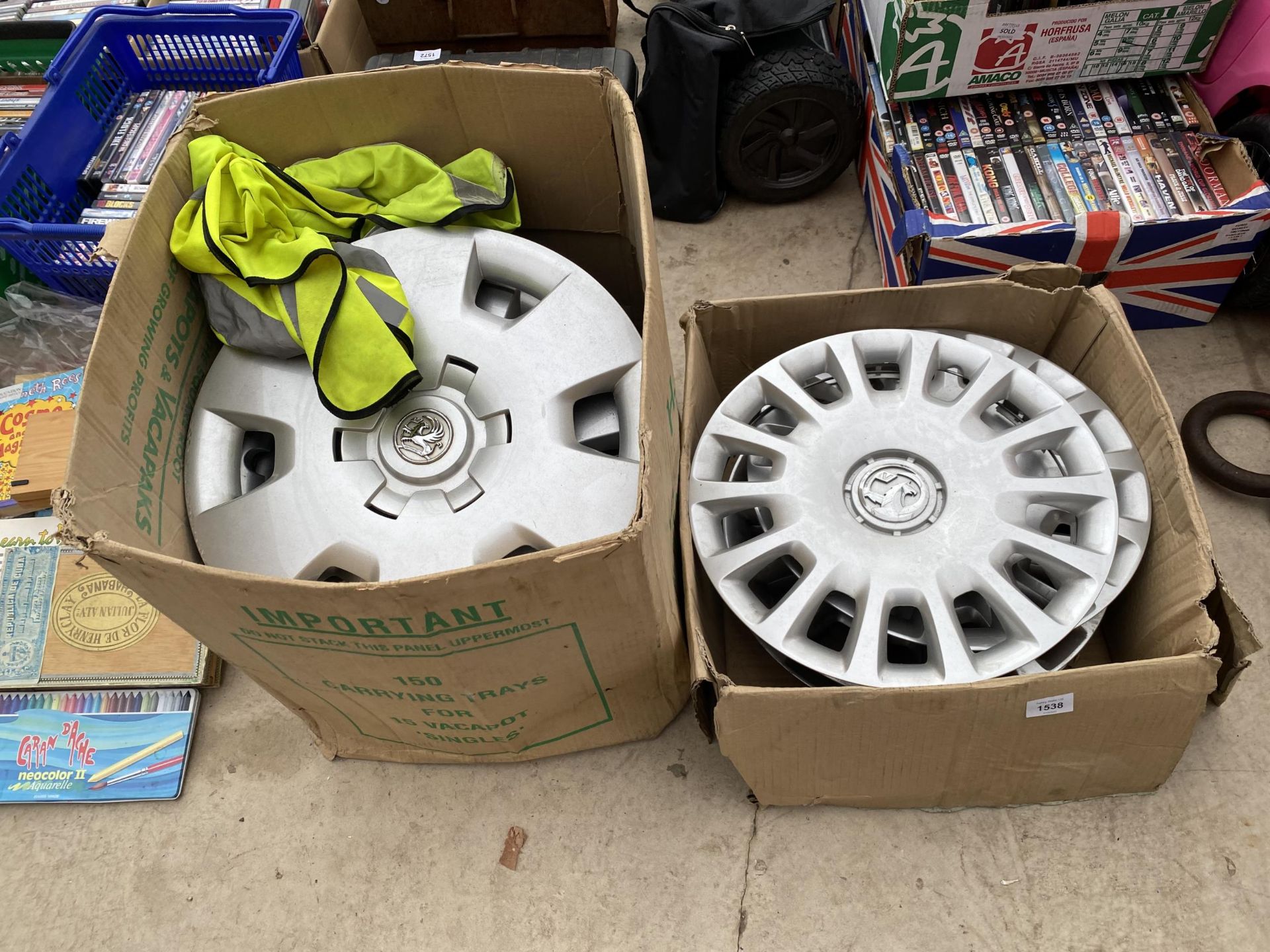 A COLLECTION OF VAUXHALL WHEEL RIMS AND TWO HI-VIZ JACKETS