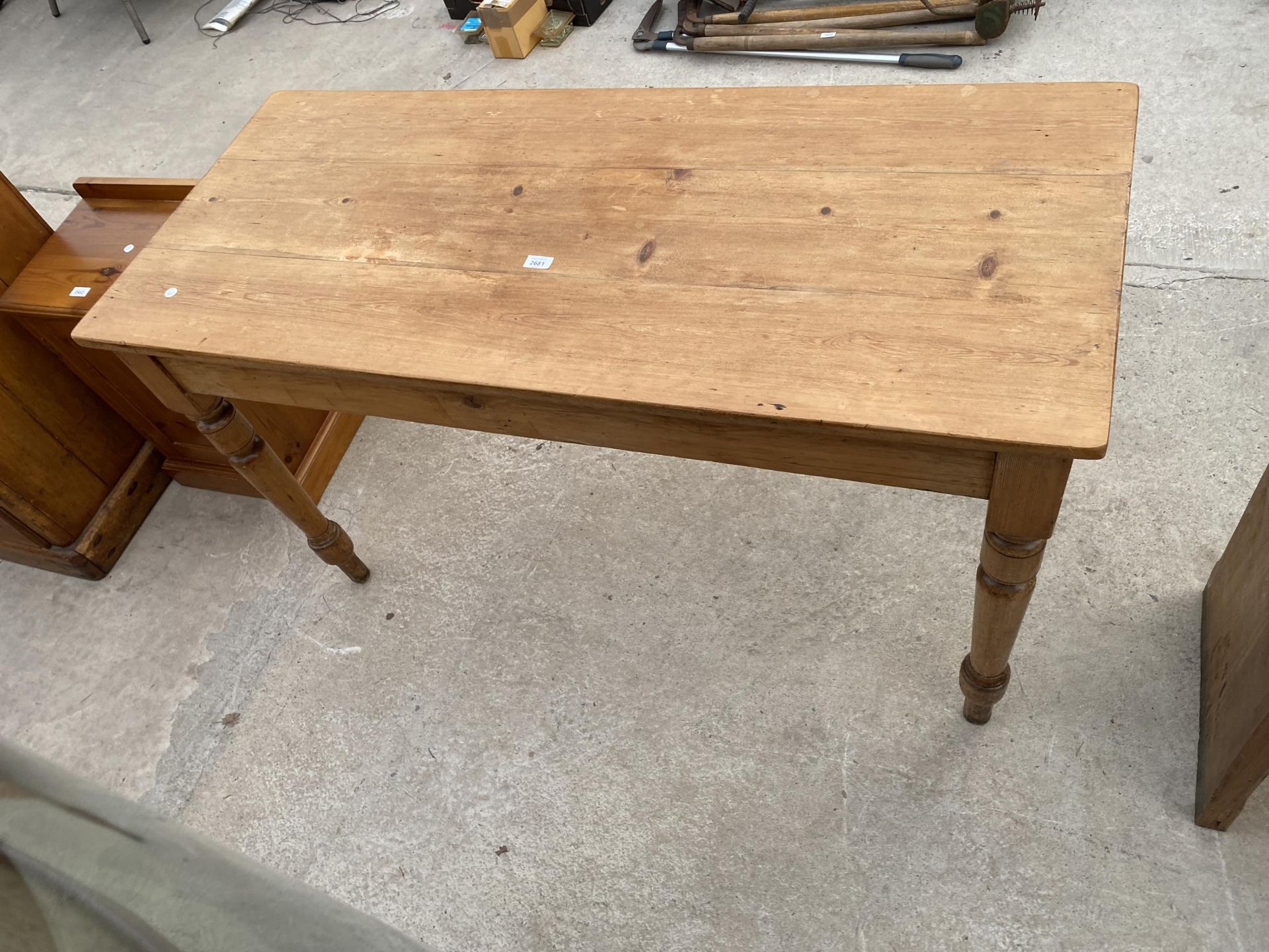A VICTORIAN PINE KITCHEN TABLE ON TURNED LEGS, 54X24"