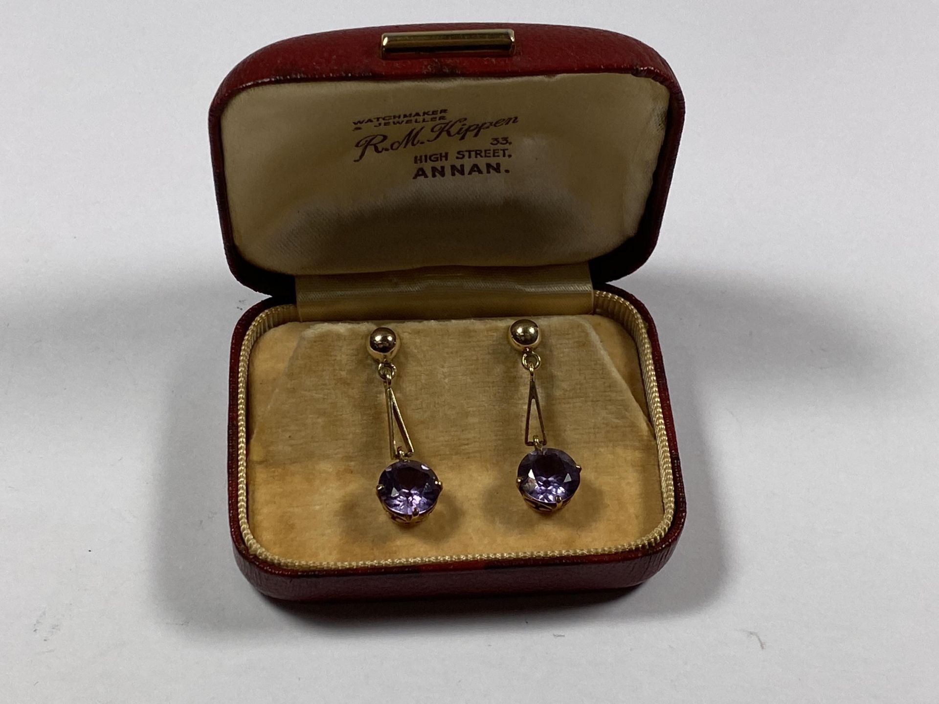 A PAIR OF YELLOW GOLD AND AMETHYST STONE EARRINGS, BOXED