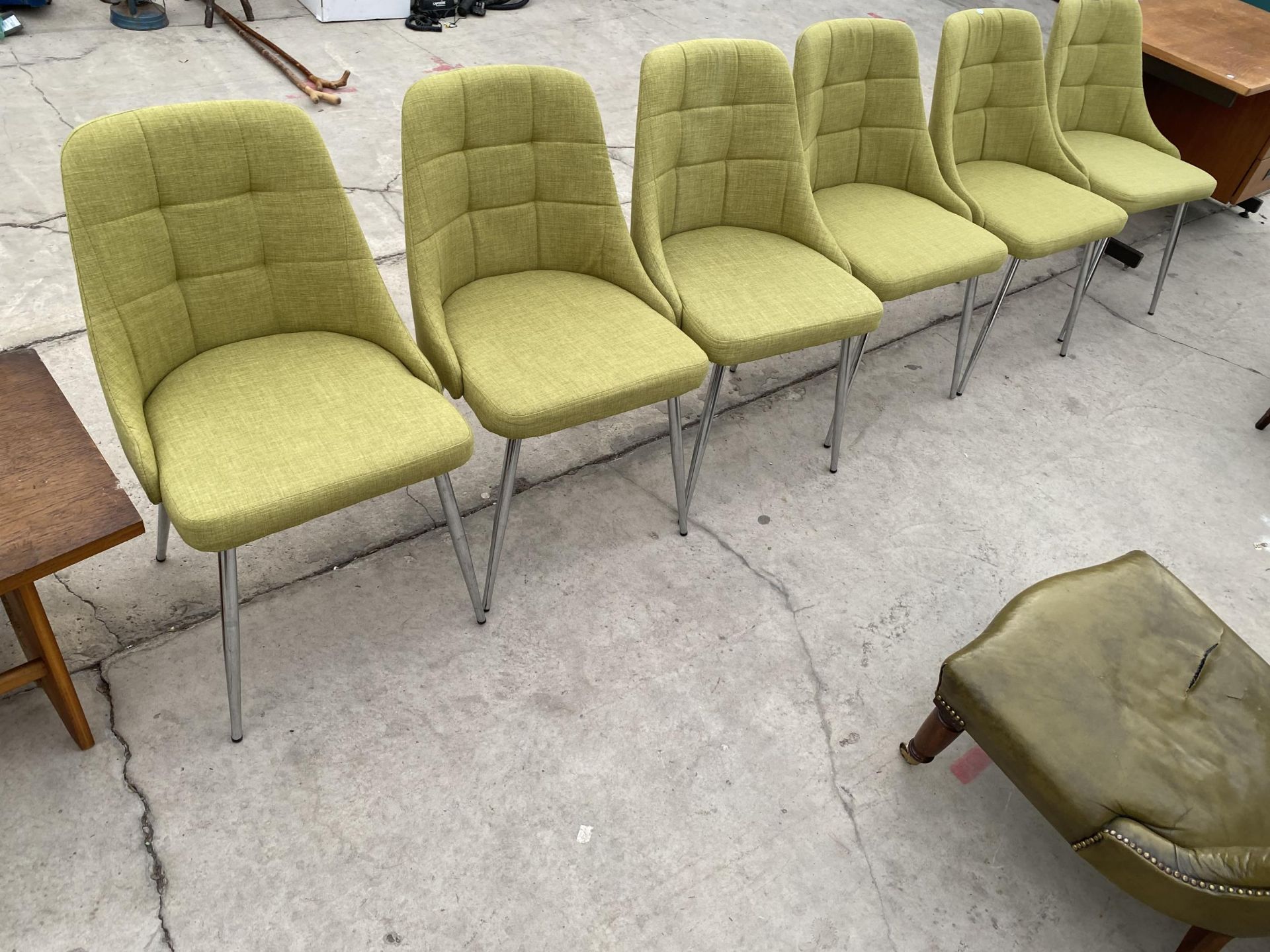 A SET OF SIX GREEN FABRIC 'SHANGHAI' CHAIRS ON POLISHED CHROME LEGS