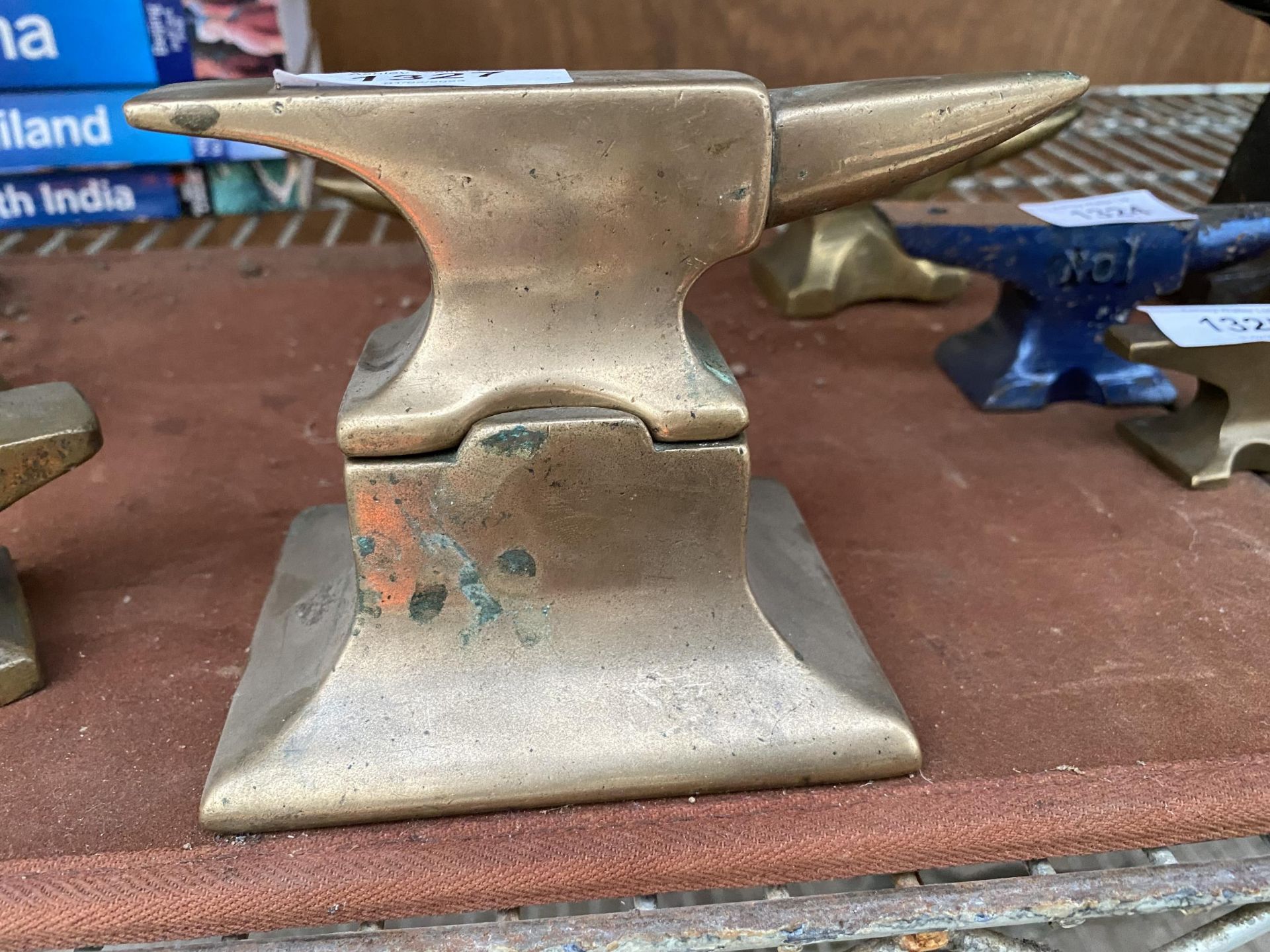 A MINITURE BRASS SAMPLE ANVIL WITH BRASS STAND